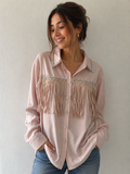 Lichtroze blouse met strassteentjes en franjes